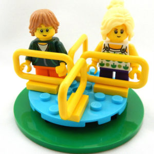 Two LEGO Kids Minifigs on a Merry-Go-Round